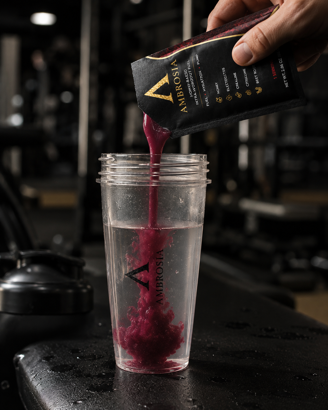 Ambrosia Fuel being poured into a water cup in the gym